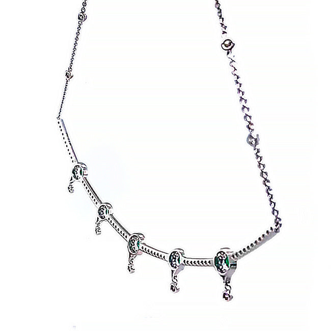18 kt gold delicate necklace with emeralds and diamonds