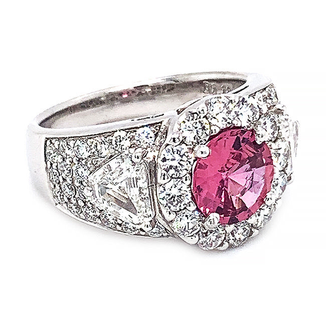 Platinum engagement ring with pink sapphire center and diamonds