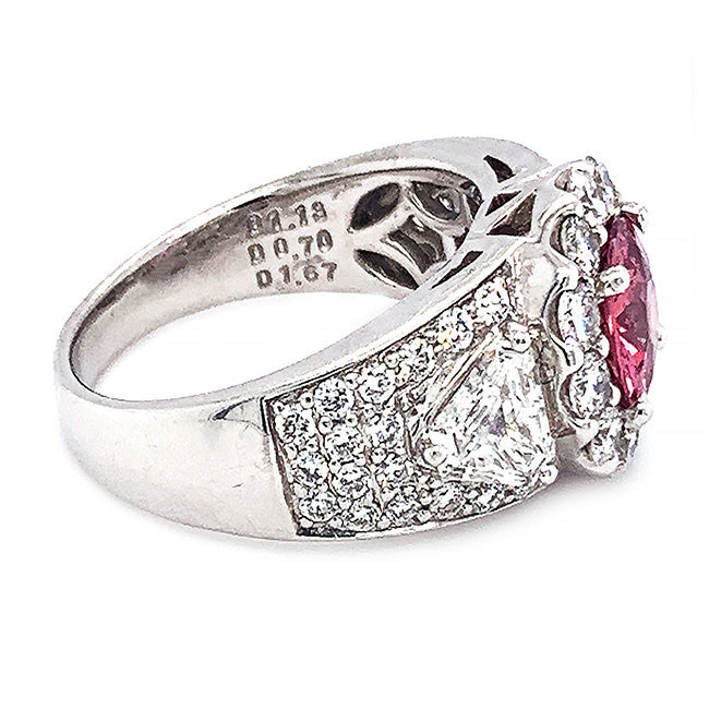 Platinum engagement ring with pink sapphire center and diamonds