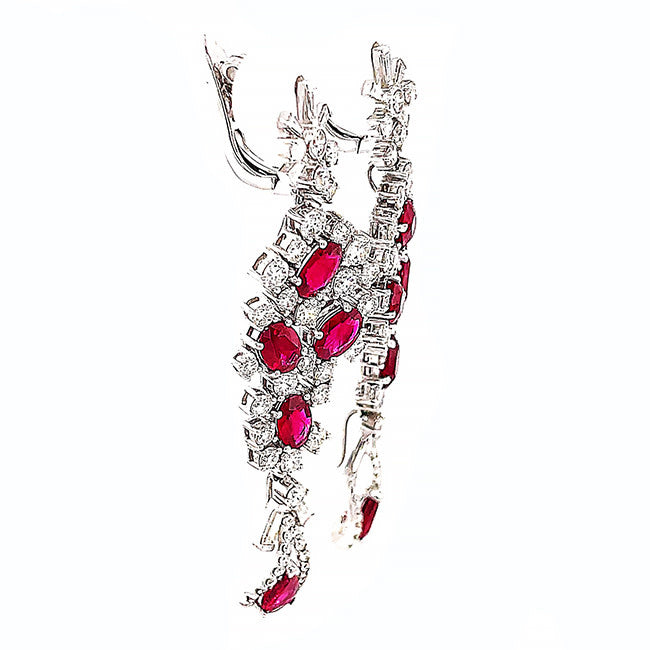 Platinum dangling earrings with no heat Ruby’s and diamonds. Call for price.