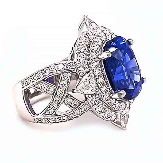 Platinum engagement ring with 7.5 ct blue Sapphire and diamonds. Call for price.