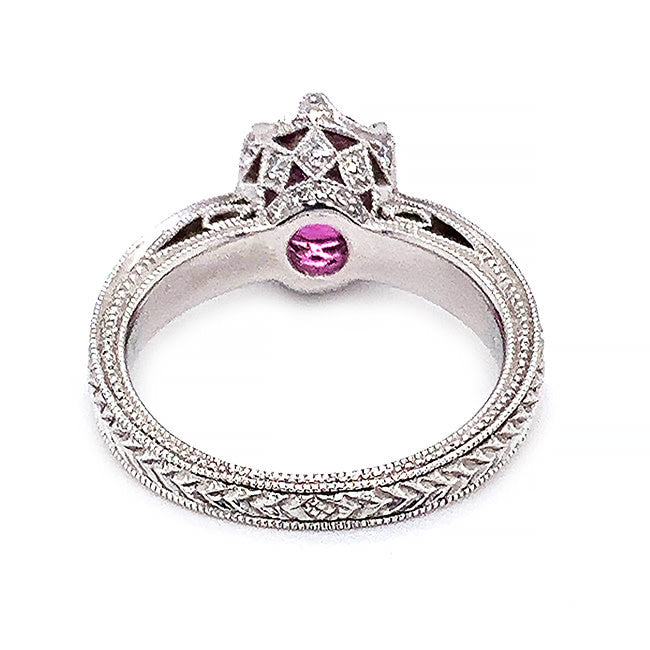 Platinum engagement ring with pink sapphire and diamonds