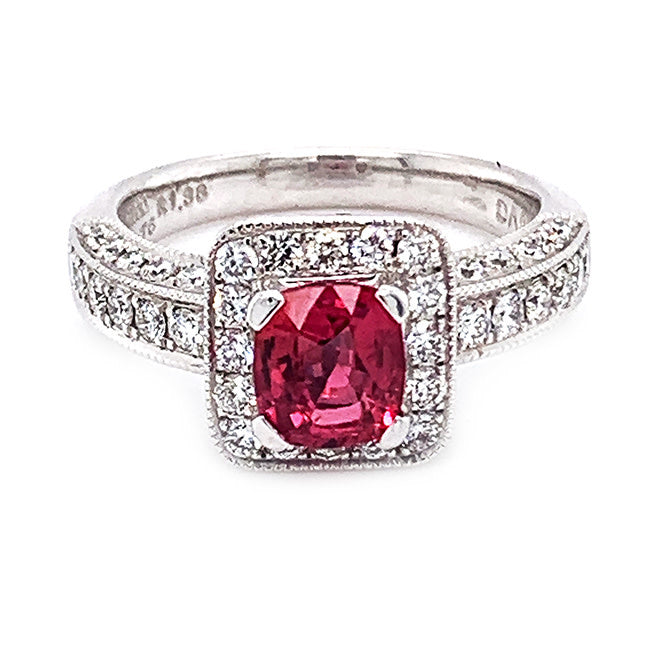 Platinum engagement ring with pink sapphire center and diamonds