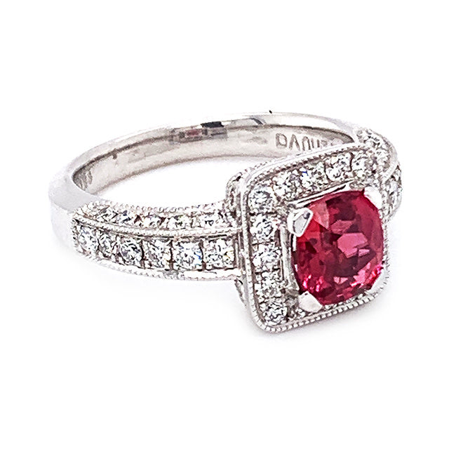 Platinum engagement ring with pink sapphire center and diamonds