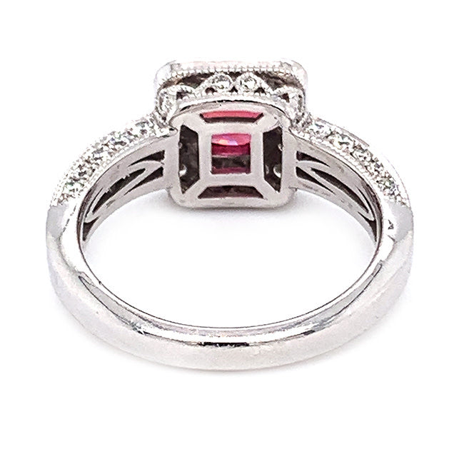 Platinum engagement ring with pink sapphire center and diamonds